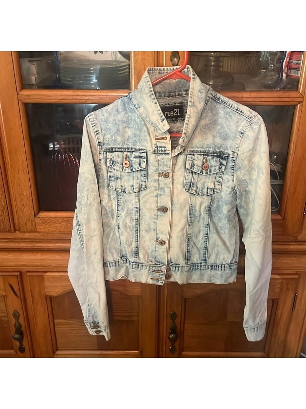 A junior, long sleeve, jean jacket